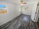 Bright bedroom with wood-look flooring and ample natural light at 11397 86Th Ave, Seminole, FL 33772