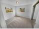 Simple bedroom with neutral carpeting and large windows at 11397 86Th Ave, Seminole, FL 33772
