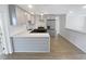 Modern kitchen with gray cabinets, quartz countertops, and stainless steel appliances at 11397 86Th Ave, Seminole, FL 33772