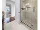 Clean bathroom with a glass shower and neutral tile at 7431 39Th E Ct, Sarasota, FL 34243