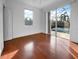 Bright bedroom with wood floors and sliding doors to the pool area at 7431 39Th E Ct, Sarasota, FL 34243