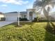 Single-story home with a two-car garage and manicured lawn at 7431 39Th E Ct, Sarasota, FL 34243