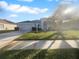 Single story home with a two car garage and grassy lawn at 7431 39Th E Ct, Sarasota, FL 34243