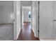 Bright hallway with hardwood floors and access to bedrooms at 7431 39Th E Ct, Sarasota, FL 34243