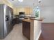 Modern kitchen with stainless steel appliances and granite countertops at 7431 39Th E Ct, Sarasota, FL 34243