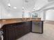 Kitchen with granite countertops, stainless steel appliances, and breakfast bar at 7431 39Th E Ct, Sarasota, FL 34243