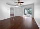 Bright living room with hardwood floors and sliding glass doors leading to the backyard at 7431 39Th E Ct, Sarasota, FL 34243