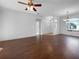 Large living area with hardwood floors, high ceilings, and lots of natural light at 7431 39Th E Ct, Sarasota, FL 34243