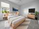 Light and airy bedroom with a large bed and plenty of closet space at 7431 39Th E Ct, Sarasota, FL 34243