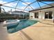 View of refreshing pool and spa with covered patio at 7431 39Th E Ct, Sarasota, FL 34243