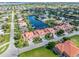 Aerial perspective of a canal-front property with multiple villas at 818 Via Tripoli, Punta Gorda, FL 33950
