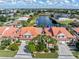 Aerial view of canal-front homes with lush landscaping and boat docks at 818 Via Tripoli, Punta Gorda, FL 33950
