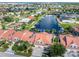 Aerial view of a row of waterfront villas with red tile roofs at 818 Via Tripoli, Punta Gorda, FL 33950