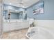Spa-like bathroom with double vanity and soaking tub at 818 Via Tripoli, Punta Gorda, FL 33950