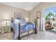 Bright bedroom with a comfortable bed and access to patio at 818 Via Tripoli, Punta Gorda, FL 33950