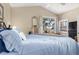Bright bedroom with a comfortable bed and access to a balcony at 818 Via Tripoli, Punta Gorda, FL 33950