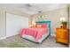 Bedroom with coral bedding and teal headboard at 818 Via Tripoli, Punta Gorda, FL 33950