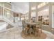 Casual dining area with a light wood table and chairs near the kitchen at 818 Via Tripoli, Punta Gorda, FL 33950