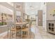 Open concept dining area with kitchen access and views to backyard at 818 Via Tripoli, Punta Gorda, FL 33950