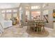 Bright dining area features a farmhouse style table with four chairs at 818 Via Tripoli, Punta Gorda, FL 33950