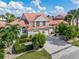 Tan two-story home with terracotta roof and two-car garage at 818 Via Tripoli, Punta Gorda, FL 33950