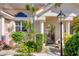 Front entrance with gate and lamp post at 818 Via Tripoli, Punta Gorda, FL 33950