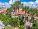 Inviting villa with terracotta roof and lush landscaping at 818 Via Tripoli, Punta Gorda, FL 33950
