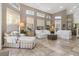 Sunlit living area with ample seating, large windows, and tile floors at 818 Via Tripoli, Punta Gorda, FL 33950