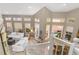 Bright living room with vaulted ceilings and white sofas at 818 Via Tripoli, Punta Gorda, FL 33950