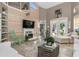 Relaxing living room features a vaulted ceiling, fireplace, and wood wall at 818 Via Tripoli, Punta Gorda, FL 33950