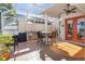 Outdoor kitchen with built-in grill, sink, and bar seating at 818 Via Tripoli, Punta Gorda, FL 33950