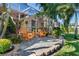 Peaceful patio space with orange chairs and gravel ground at 818 Via Tripoli, Punta Gorda, FL 33950