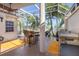 Outdoor patio with fire pit and built-in grill at 818 Via Tripoli, Punta Gorda, FL 33950