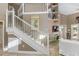 Elegant staircase with white railing and access to upper level at 818 Via Tripoli, Punta Gorda, FL 33950