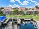 Backyard oasis with covered patio, boat dock, and canal access at 818 Via Tripoli, Punta Gorda, FL 33950