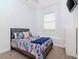 Bright bedroom with a double bed and window coverings at 320 Georgia Ave, Crystal Beach, FL 34681