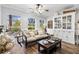 Relaxing living room with light beige sofa, coffee table and built in hutch at 4086 Gardner Dr, Port Charlotte, FL 33952