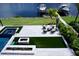 Luxury backyard with patio furniture and waterfront views at 811 Manns Harbor Dr, Apollo Beach, FL 33572