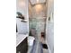 Modern bathroom with a large walk-in shower and dark vanity at 811 Manns Harbor Dr, Apollo Beach, FL 33572