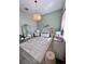 Pastel-themed Bedroom with crib, glider, and giraffe decor at 811 Manns Harbor Dr, Apollo Beach, FL 33572