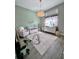 Charming Bedroom with a crib, glider, and plenty of natural light at 811 Manns Harbor Dr, Apollo Beach, FL 33572