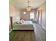 Elegant bedroom with a plush bed and pink color scheme at 811 Manns Harbor Dr, Apollo Beach, FL 33572