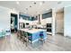 Modern kitchen with blue island and stainless steel appliances at 811 Manns Harbor Dr, Apollo Beach, FL 33572