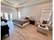 Large main bedroom with sitting area and access to backyard at 811 Manns Harbor Dr, Apollo Beach, FL 33572