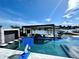 Large pool and patio with water views and basketball hoop at 811 Manns Harbor Dr, Apollo Beach, FL 33572