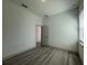 Neutral bedroom featuring durable gray-toned flooring and a bright window at 135 Sunset Rd, Rotonda West, FL 33947