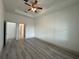 Spacious bedroom with wood floors, recessed lighting, ceiling fan, and ample closet space at 135 Sunset Rd, Rotonda West, FL 33947