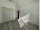 Bedroom featuring wood-look floors and a closet with folding doors at 135 Sunset Rd, Rotonda West, FL 33947