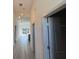 Bright hallway with recessed lighting and stylish pendant lights leading to an airy living space at 135 Sunset Rd, Rotonda West, FL 33947