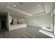 Bright and airy living room with recessed lighting and sliding glass doors to the outside at 135 Sunset Rd, Rotonda West, FL 33947